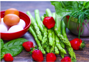 A mix of fruit and vegetables with a bowl of eggs.